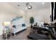 Stylish living space with sleek hardwood floors, modern decor, and plenty of natural light at 8113 Via Vittoria Way, Orlando, FL 32819