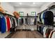 Spacious walk-in closet with custom shelving, providing ample storage for clothing and accessories at 8113 Via Vittoria Way, Orlando, FL 32819