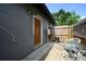 Cozy back patio with seating, fenced for privacy, and access to the home's entrance at 874 Brevard Ct, Orlando, FL 32822