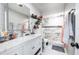 Bathroom featuring marble tile, neutral paint, shower, toilet, and sink area at 874 Brevard Ct, Orlando, FL 32822