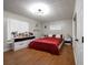Bedroom featuring a red bedspread and a well-lit makeup vanity at 874 Brevard Ct, Orlando, FL 32822