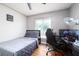 Bedroom featuring wood flooring, windows with blinds, and overhead fan at 874 Brevard Ct, Orlando, FL 32822
