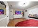 A primary bedroom with a TV sitting atop a white dresser and decorative stone accents at 874 Brevard Ct, Orlando, FL 32822