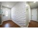 Entryway with a unique decorative wall and hardwood floors at 874 Brevard Ct, Orlando, FL 32822