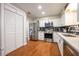 The gourmet kitchen features modern appliances and beautiful white cabinets at 874 Brevard Ct, Orlando, FL 32822