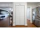 Open kitchen layout with adjacent pantry and stainless steel refrigerator at 874 Brevard Ct, Orlando, FL 32822