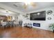 Cozy living room featuring wood floors, modern fireplace, and stylish decor at 874 Brevard Ct, Orlando, FL 32822
