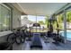 Enclosed sunroom featuring exercise equipment and access to the backyard pool at 874 Brevard Ct, Orlando, FL 32822