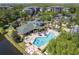 Aerial view of the community amenities featuring a resort style pool and clubhouse at 9051 Treasure Trove Ln # 505, Kissimmee, FL 34747