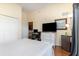 Bedroom featuring a queen bed, wood floors, TV and large closet at 9051 Treasure Trove Ln # 505, Kissimmee, FL 34747