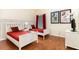 The bedroom features two twin beds, wood floors, and Disney themed wall decor at 9051 Treasure Trove Ln # 505, Kissimmee, FL 34747