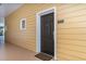 The condo entrance featuring a brown door with a window and unit number at 9051 Treasure Trove Ln # 505, Kissimmee, FL 34747