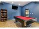 Well-lit game room featuring a vibrant pool table and bookshelf at 9051 Treasure Trove Ln # 505, Kissimmee, FL 34747