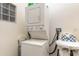 Cozy laundry space features a stacked washer/dryer unit at 9051 Treasure Trove Ln # 505, Kissimmee, FL 34747