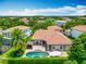 Aerial view of a home with a beautiful backyard pool, spa and outdoor cabana at 9942 Hatton Cir, Orlando, FL 32832