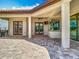 Elegant back patio with a tiled roof, ample seating, and access to the pool area for relaxation at 9942 Hatton Cir, Orlando, FL 32832