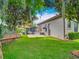 Expansive backyard features a lush lawn, cozy hammock, and outdoor seating near the pool at 9942 Hatton Cir, Orlando, FL 32832