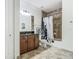 Bathroom featuring a granite vanity and shower/tub combination at 9942 Hatton Cir, Orlando, FL 32832