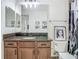 Bathroom featuring a granite vanity and shower/tub combination at 9942 Hatton Cir, Orlando, FL 32832