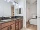 Bright bathroom featuring double vanity, granite counters, and en-suite access at 9942 Hatton Cir, Orlando, FL 32832