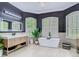 Elegant bathroom with a sleek vanity, soaking tub, and modern fixtures at 9942 Hatton Cir, Orlando, FL 32832
