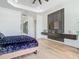 Stylish bedroom features a floating console, unique panel wall, and modern finishes at 9942 Hatton Cir, Orlando, FL 32832