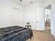 Bright bedroom featuring modern flooring, closet, neutral paint, and en-suite access at 9942 Hatton Cir, Orlando, FL 32832