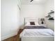 Bright bedroom featuring modern flooring, shelving, neutral paint, and closet at 9942 Hatton Cir, Orlando, FL 32832