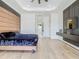 Bright bedroom with stylish wood accent wall and floating console at 9942 Hatton Cir, Orlando, FL 32832