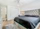 Bedroom featuring a plush headboard bed, modern fan, and a decorative vanity area at 9942 Hatton Cir, Orlando, FL 32832