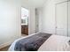 Bright bedroom with bathroom en suite featuring a modern vanity and tile flooring at 9942 Hatton Cir, Orlando, FL 32832