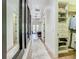 Hallway view showing large mirrors, a walk-in closet, and a path to the bed at 9942 Hatton Cir, Orlando, FL 32832