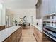 Gourmet kitchen with modern cabinetry, stainless appliances, and an easy flow into the dining area at 9942 Hatton Cir, Orlando, FL 32832