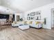 Open-concept living room showcases modern design and a cozy white sectional at 9942 Hatton Cir, Orlando, FL 32832