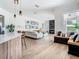 Bright and airy living room featuring modern decor, sleek furniture, and a cozy fireplace at 9942 Hatton Cir, Orlando, FL 32832