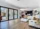 Bright open living area with sliding glass doors, stylish furnishings, and modern finishes at 9942 Hatton Cir, Orlando, FL 32832