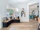 Bright living room with a window bench, modern decor, and a view into the dining area at 9942 Hatton Cir, Orlando, FL 32832