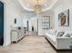 Inviting hallway features a console table, stylish decor, and comfortable white sofa at 9942 Hatton Cir, Orlando, FL 32832