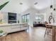 Bright living room features a modern fireplace, built-in seating, and access to the pool at 9942 Hatton Cir, Orlando, FL 32832