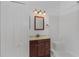 Bathroom includes a single sink vanity, shower stall, and a mirrored medicine cabinet at 100 Madden Ave, Sanford, FL 32773