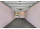Spacious garage with ample room for parking and storage, featuring a utility sink at 100 Madden Ave, Sanford, FL 32773