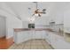 Bright kitchen with white appliances, tiled floor, providing a clean and functional space at 100 Madden Ave, Sanford, FL 32773