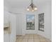 Bright eat-in kitchen featuring white cabinets, dual windows for ample natural light at 100 Madden Ave, Sanford, FL 32773