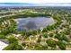 Aerial view of a home with a lake in a neighborhood at 1018 Turner Rd, Winter Park, FL 32789