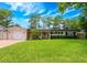 Charming single-story home with a lush green lawn and attached garage at 1018 Turner Rd, Winter Park, FL 32789