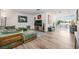 Open-concept living room featuring wood floors, comfortable seating, and ample natural light at 1018 Turner Rd, Winter Park, FL 32789