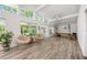 Bright and open space with large windows, ceiling fan, and pilates machine and exercise equipment at 1018 Turner Rd, Winter Park, FL 32789