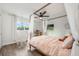 Beautiful bedroom featuring a four poster bed, a hanging chair, and a ceiling fan at 10241 Pointview Ct, Orlando, FL 32836