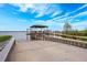 Community boat ramp provides lake access, featuring a covered gazebo and bench seating at 10241 Pointview Ct, Orlando, FL 32836