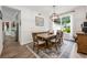 Charming dining room with stylish furnishings, natural light, and a cozy ambiance enhanced by the beautiful area rug at 10241 Pointview Ct, Orlando, FL 32836
